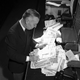 New York Club Exchange Securities A.A. Callaghan, teller in the Clearing Corporation is preparing stock certificates for final delivery in New York, Sept. 6, 1947.